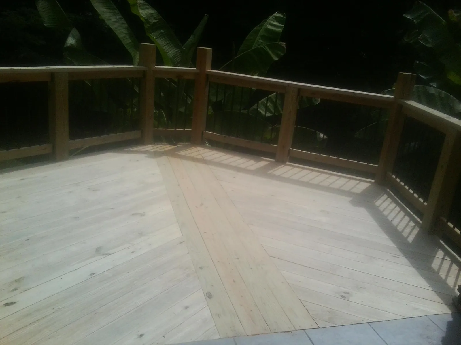 New wood deck and railing built off the back of a home in Culloden